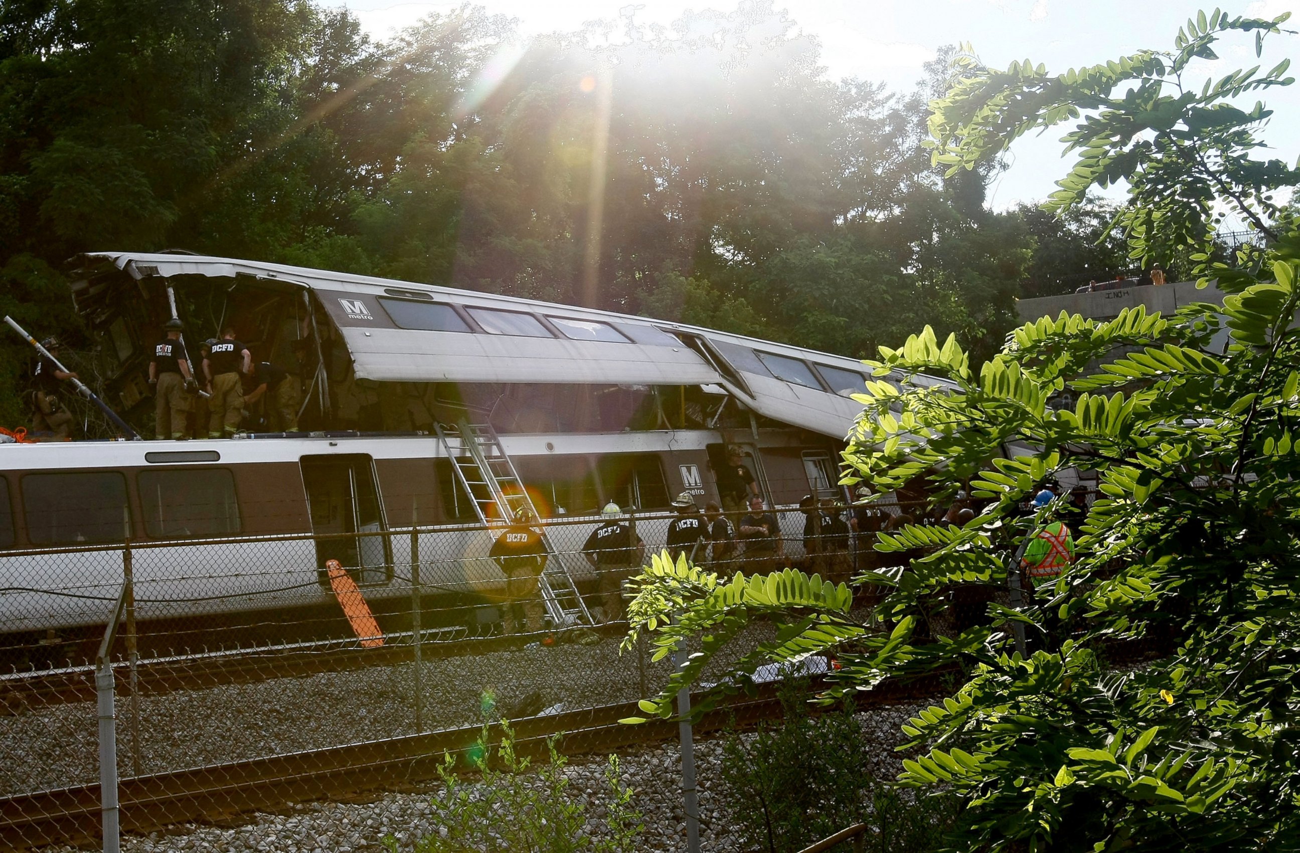 PHOTO: Rescue workers respond to the site of two Red Line Metrorail trains that collided with one another between the Fort Totten and Takoma Park stations during the evening rush hour, June 22, 2009, in Washington.