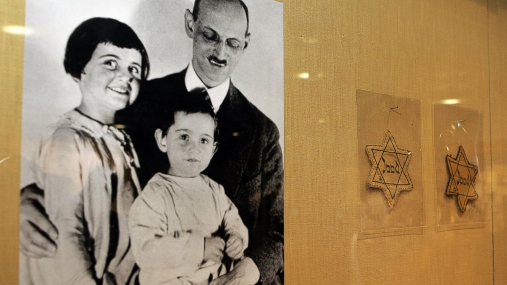 PHOTO: A photograph of Otto Frank with his daughters Anne, center, and Margaret, left, with yellow stars worn by Dutch Jews is shown over a display of documents discovered in the YIVO Institute for Jewish Research archives, Feb. 14, 2007, in New York. 