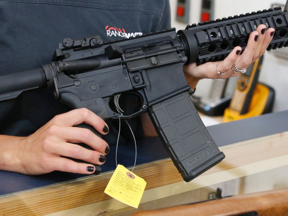 PHOTO: A woman holds a AR-15 semi-automatic gun at Action Target, June 17, 2016, in Springville, Utah.