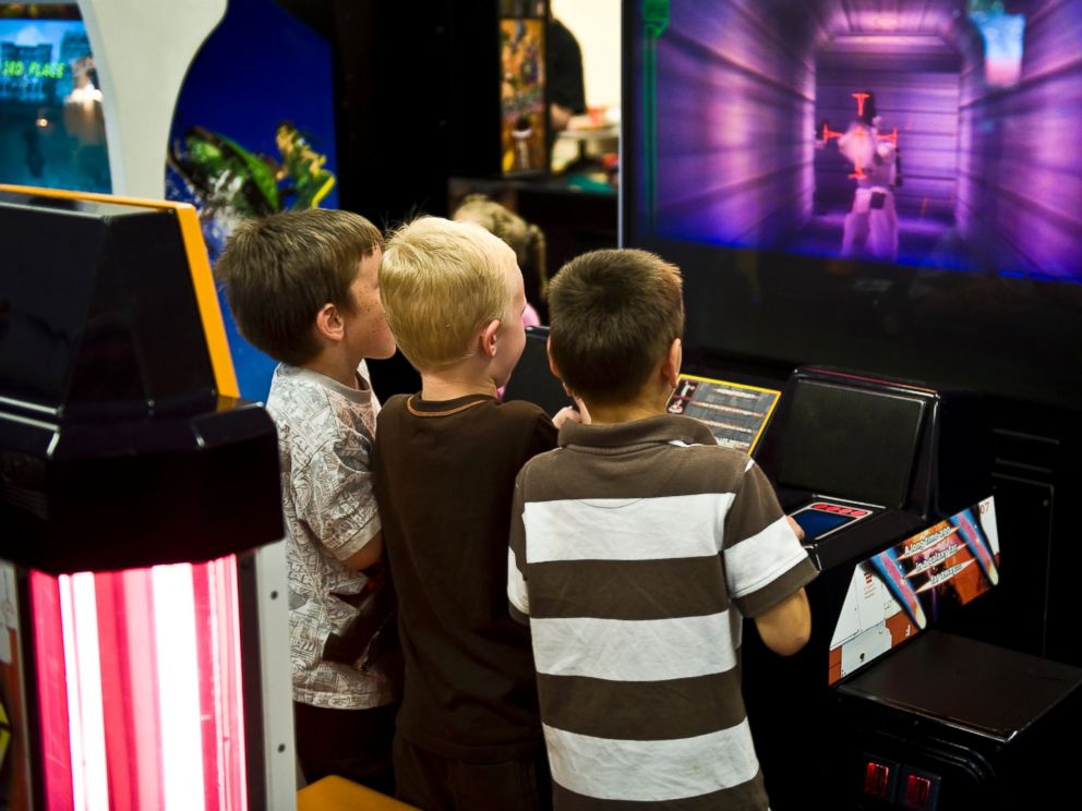 PHOTO: Boys playing a video game in an arcade are seen in this undated file photo.