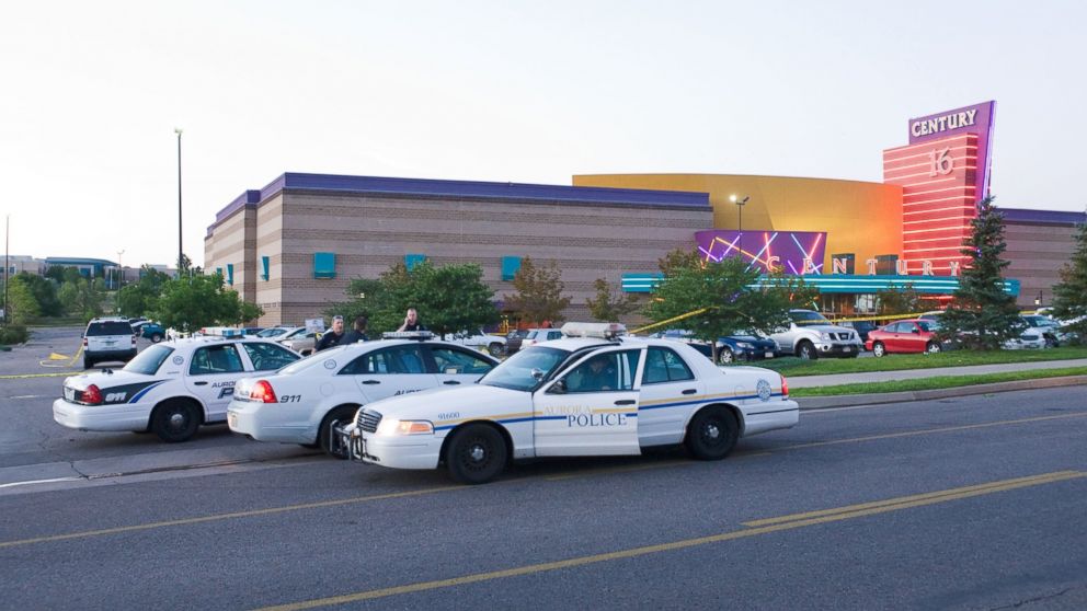 PHOTO: Police cars are seen in the parking area around the Century 16 movie theater in Aurora, Colo., July 20, 2012 where a gunman opened fire during the showing of the new Batman movie.