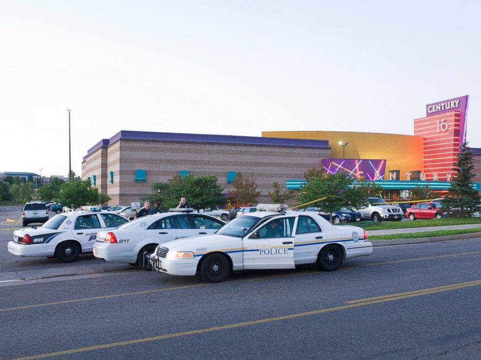 PHOTO: Police cars are seen in the parking area around the Century 16 movie theater in Aurora, Colo., July 20, 2012 where a gunman opened fire during the showing of the new Batman movie.