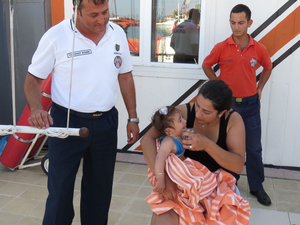 PHOTO: Ten-month-old baby Melda Ilgin is seen on her mother's lap after being saved by Turkish coast guard when she drifted a kilometer out to sea on a sea buoy in Ayvacik district of Canakkale province, Turkey, July 3, 2015. 