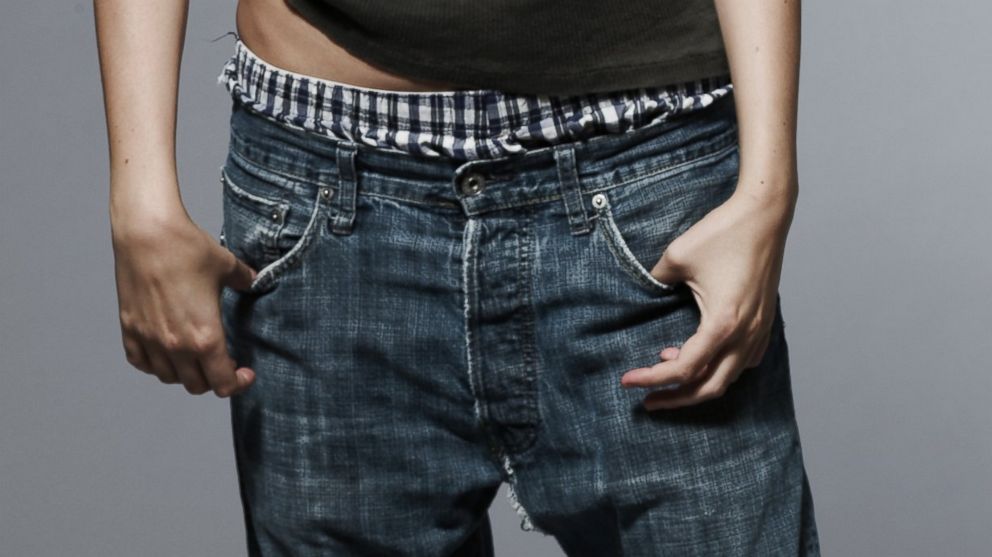 PHOTO: A woman wears loose-fitting jeans.