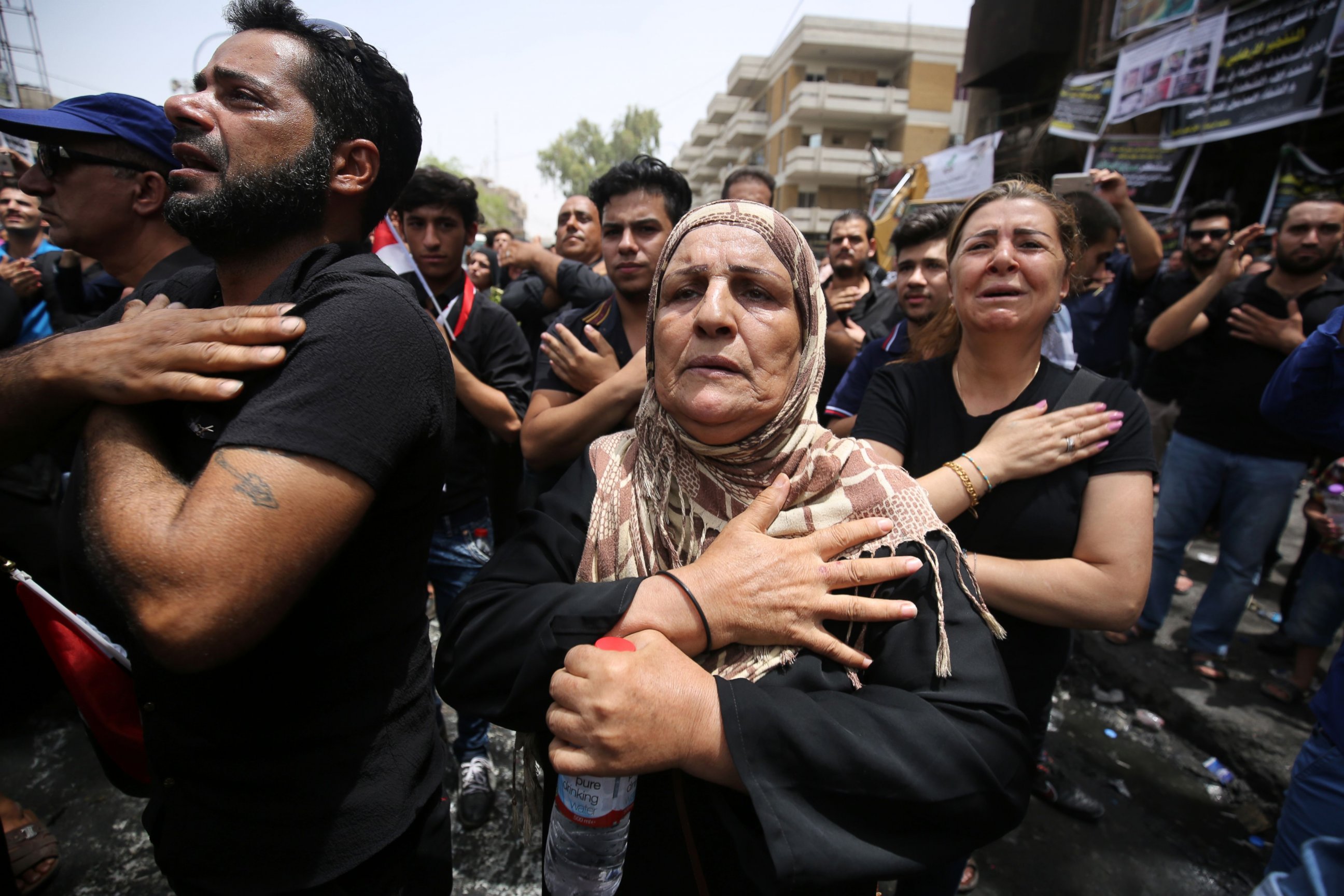 PHOTO: Iraqis beat themselves on the chest on July 6, 2016, as they mourn the victims of a suicide bombing that ripped through Baghdad's busy shopping district of Karrada on July 3.