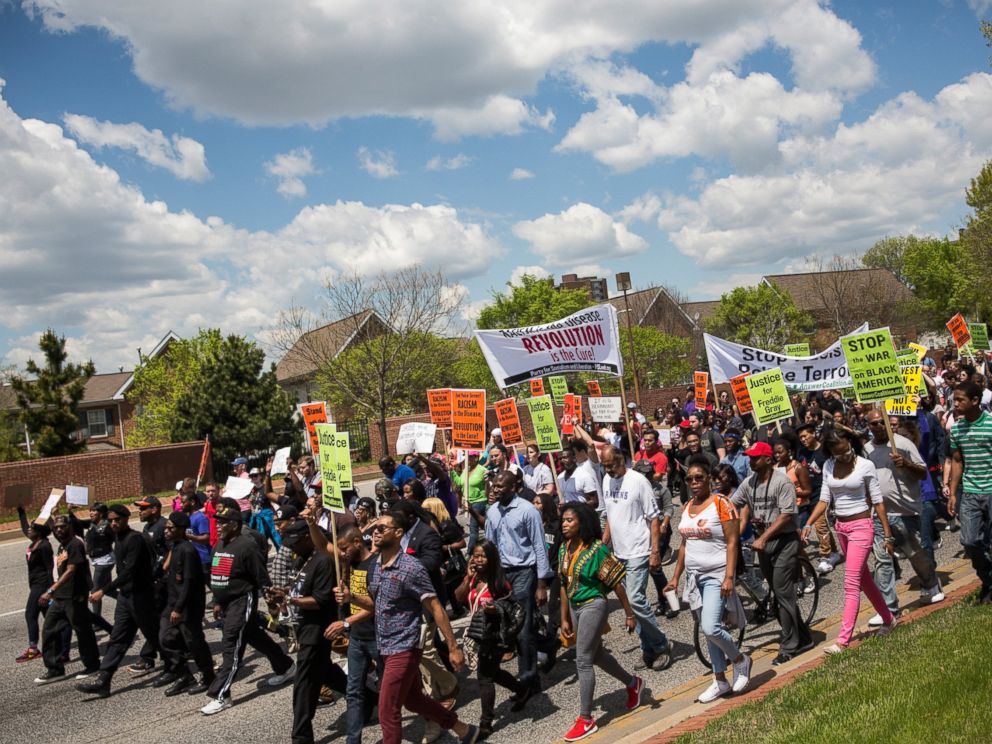 PHOTO: Protesters march from the Gilmor Homes, where Freddie Gray was arrested, to City Hall on May 2, 2015 in Baltimore, Md.