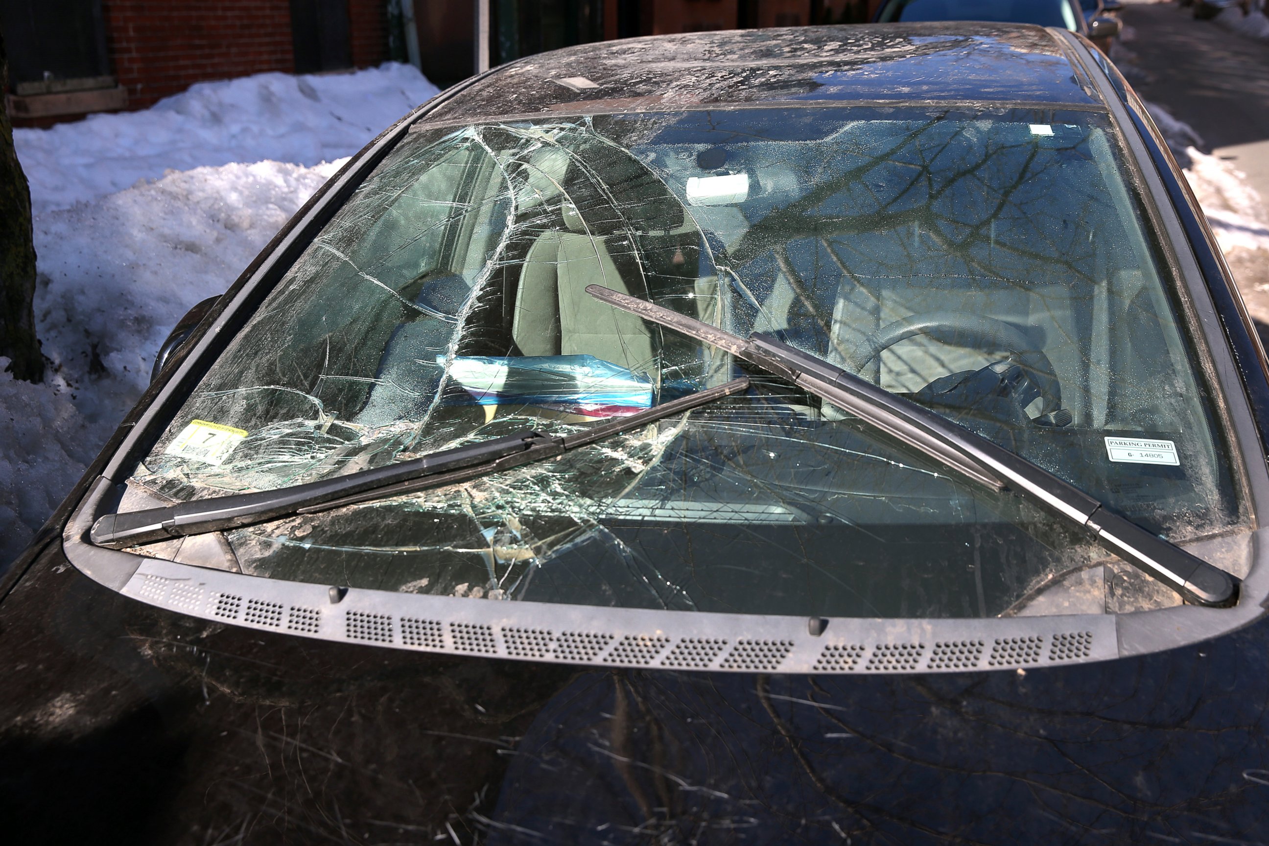 PHOTO: Jillian Tenen's car is seen parked on Isabella Street in Boston, March 18, 2015, showing damages from being trapped under snow all winter.