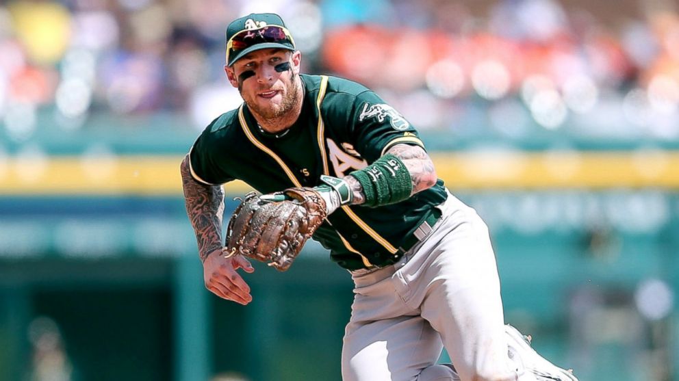 PHOTO: Brett Lawrie #15 of the Oakland Athletics fields the ground ball during the fifth inning of the game against the Detroit Tigers, June 4, 2015, at Comerica Park in Detroit.