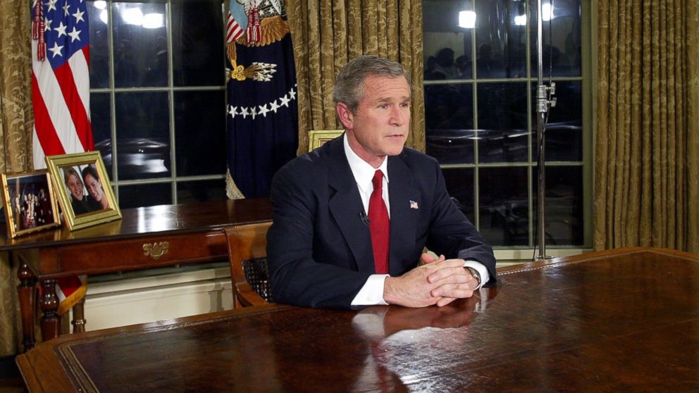 Then President George W. Bush addresses the nation, March 19, 2003, in the Oval Office of the White House in Washington.
