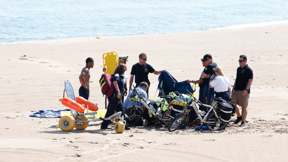 PHOTO: A Navy Leap Frog parachuter receives medical attention on North Avenue Beach on Aug. 15, 2015, after a performance at the first day of the annual Chicago Air & Water Show in Chicago. 