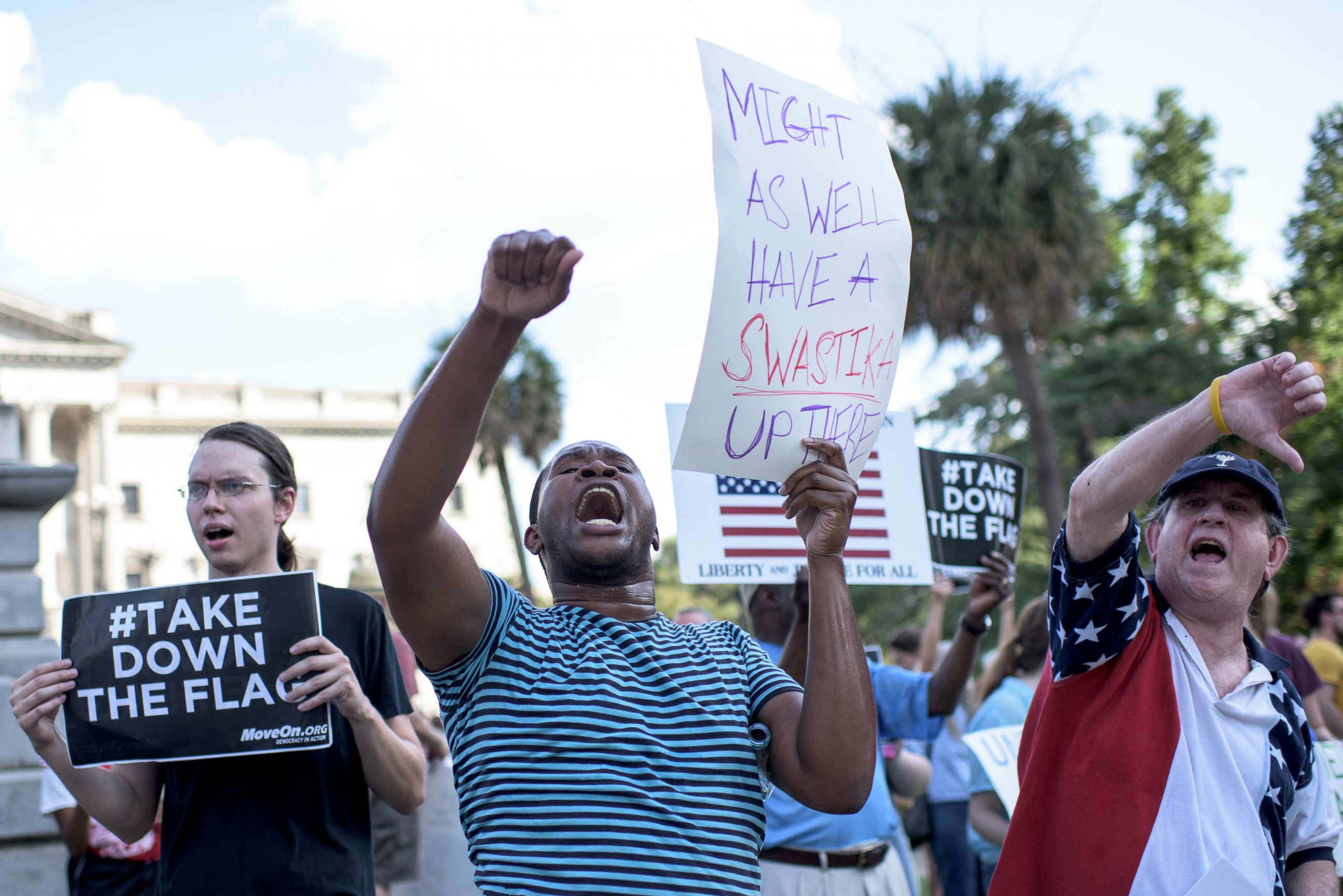 PHOTO: People gather to protest the confederate flag which flies in front of the South Carolina Statehouse in Columbia, S.C.,  June 20, 2015.