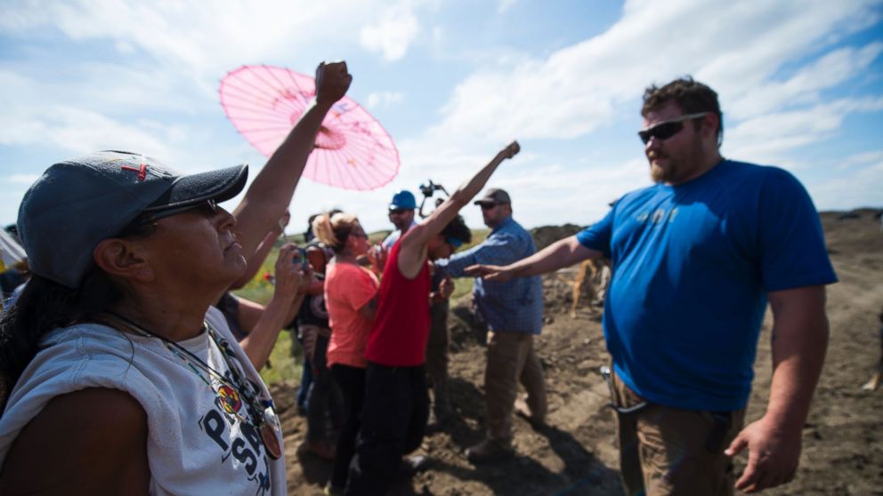 PHOTO: Security agents, right, confront protestors on the worksite for the Dakota Access Pipeline (DAPL) oil pipeline, near Cannonball, North Dakota, Sept. 3, 2016.