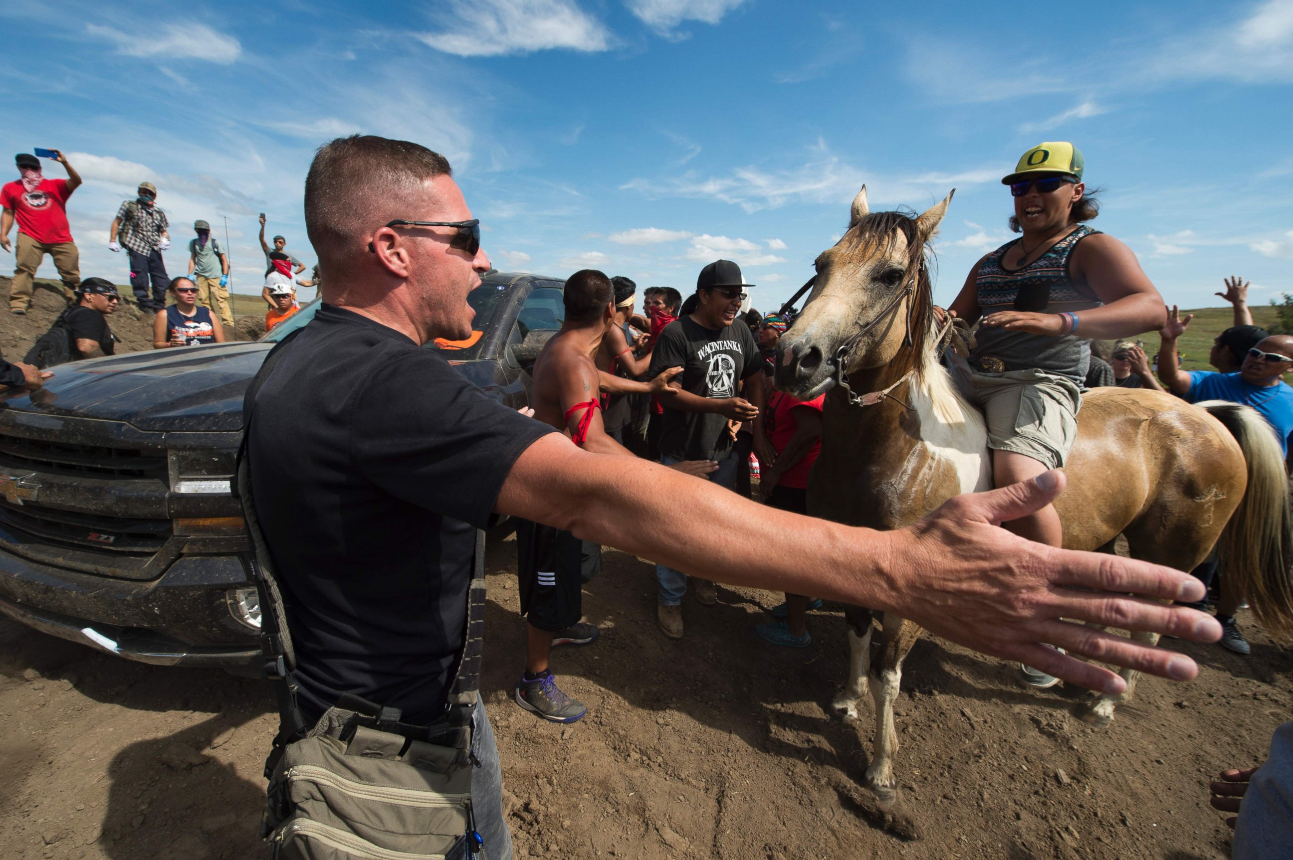 PHOTO: Native American protestors and their supporters are confronted by security during a demonstration against work being done for the Dakota Access Pipeline (DAPL) oil pipeline, near Cannonball, North Dakota, Sept. 3, 2016.