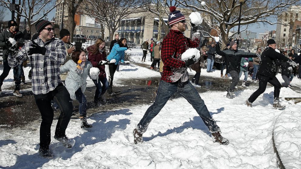 Participants take part in a snowball fight with over one hundred people in Dupont Circle, Feb. 17, 2015 in Washington.