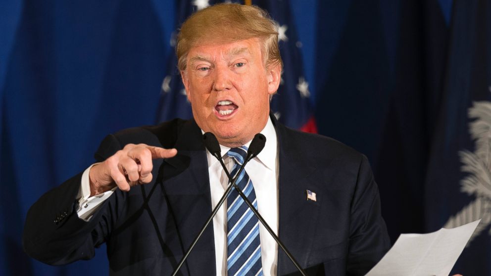 Republican presidential candidate Donald Trump reads from a statement about Pope Francis during a campaign rally in Kiawah, S.C., Feb. 17, 2016.