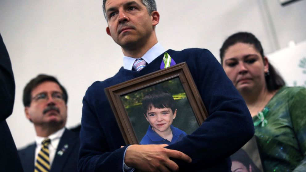 PHOTO: Ian Hockley holds a photo of his son, Dylan Hockley, during a press conference with fellow parents of victims on the one month anniversary of the Newtown elementary school massacre, Jan. 14, 2013, in Newtown, Conn.
