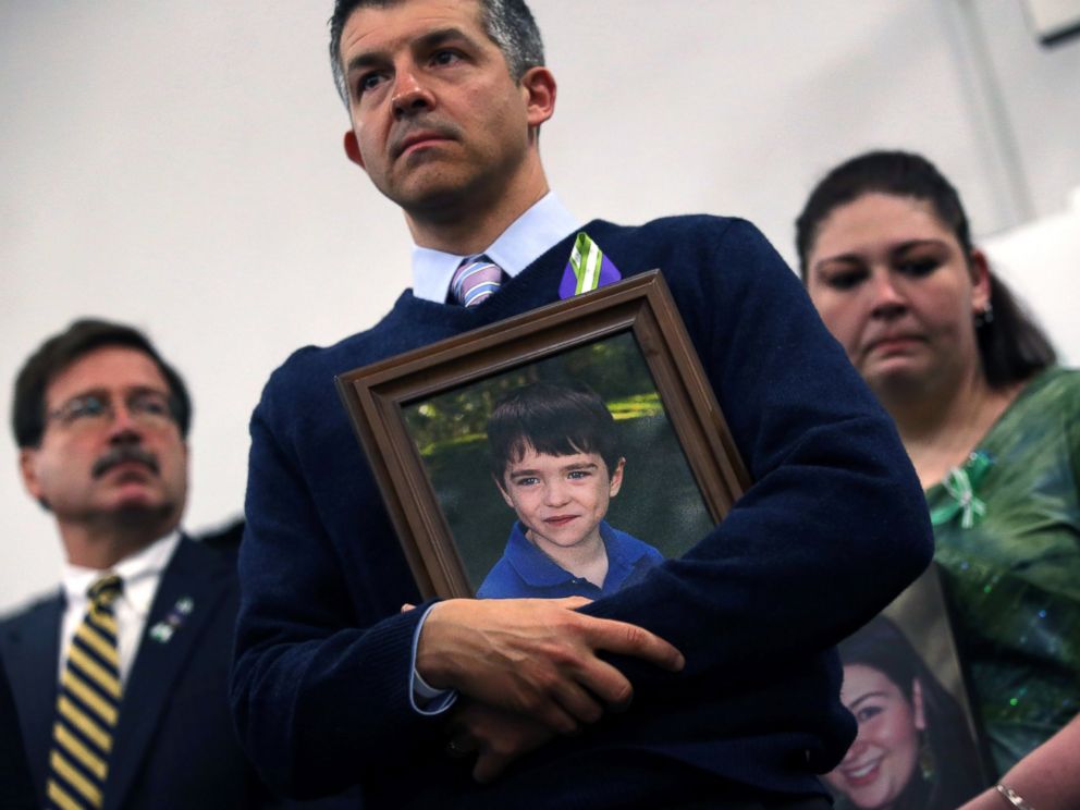 PHOTO: Ian Hockley holds a photo of his son, Dylan Hockley, during a press conference with fellow parents of victims on the one month anniversary of the Newtown elementary school massacre, Jan. 14, 2013, in Newtown, Conn.