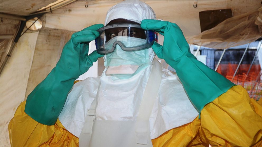 Doctors Without Borders put on protective gear at the isolation ward of the Donka Hospital in Conakry, Guinea, where people infected with the Ebola virus are being treated, June 28, 2014.