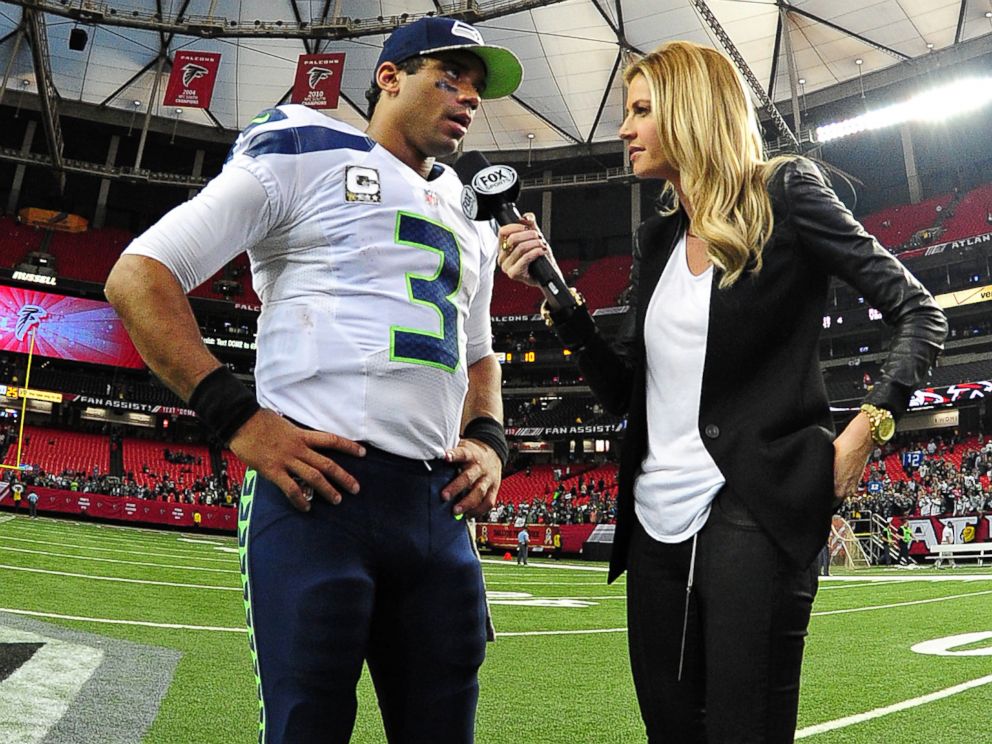 PHOTO: Russell Wilson of the Seattle Seahawks is interviewed by Erin Andrews after the game against the Atlanta Falcons at the Georgia Dome, Nov. 10, 2013 in Atlanta.