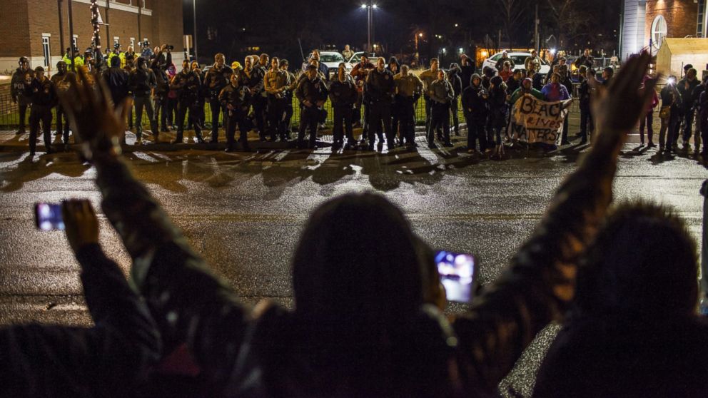 PHOTO: Protestors march in front of the Ferguson Police Department in Ferguson, Nov. 23, 2014. 