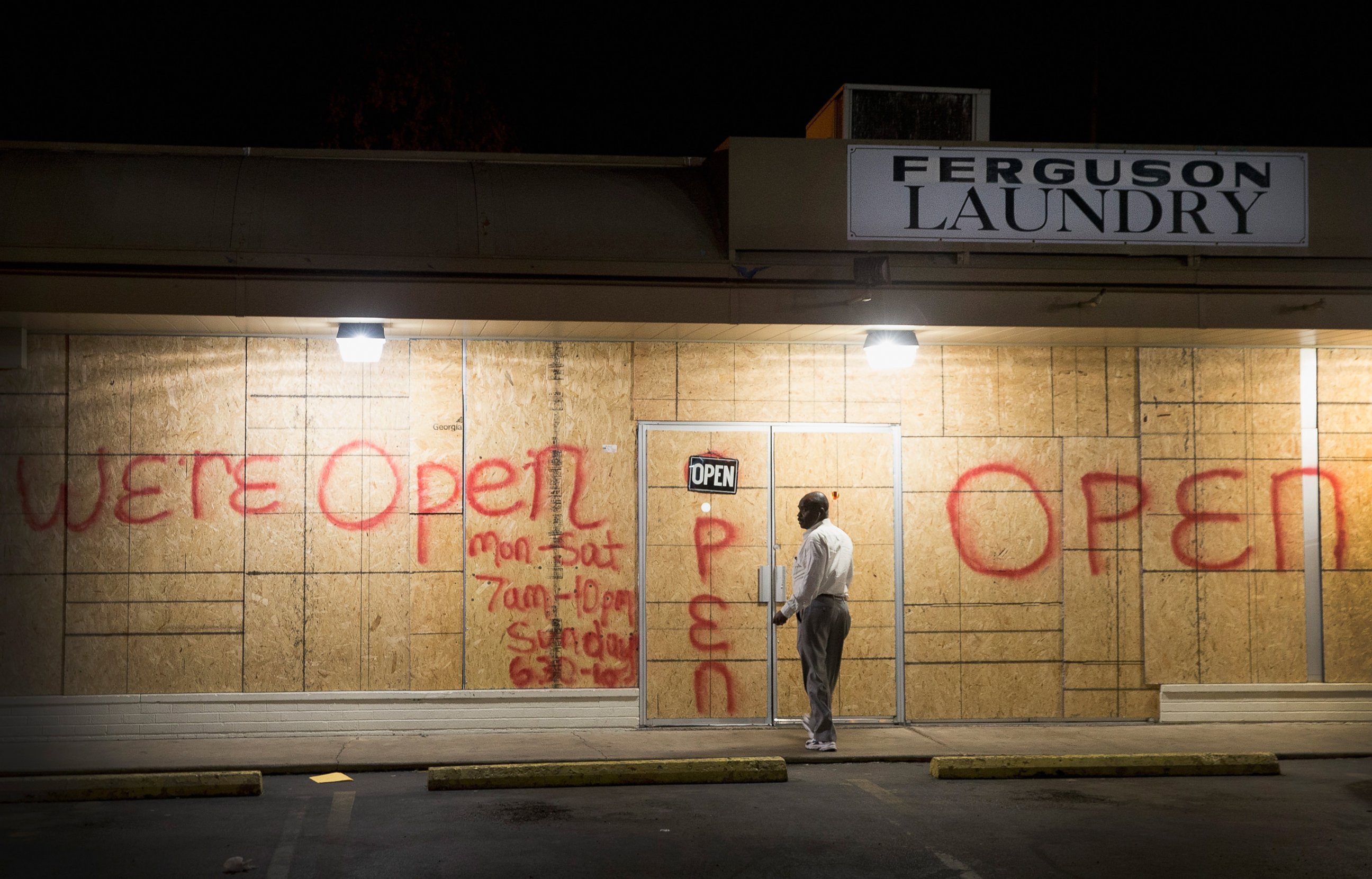 PHOTO: Plywood covers the glass front of a strip mall along West Florissant Street on Nov. 12, 2014 in Ferguson, Mo.