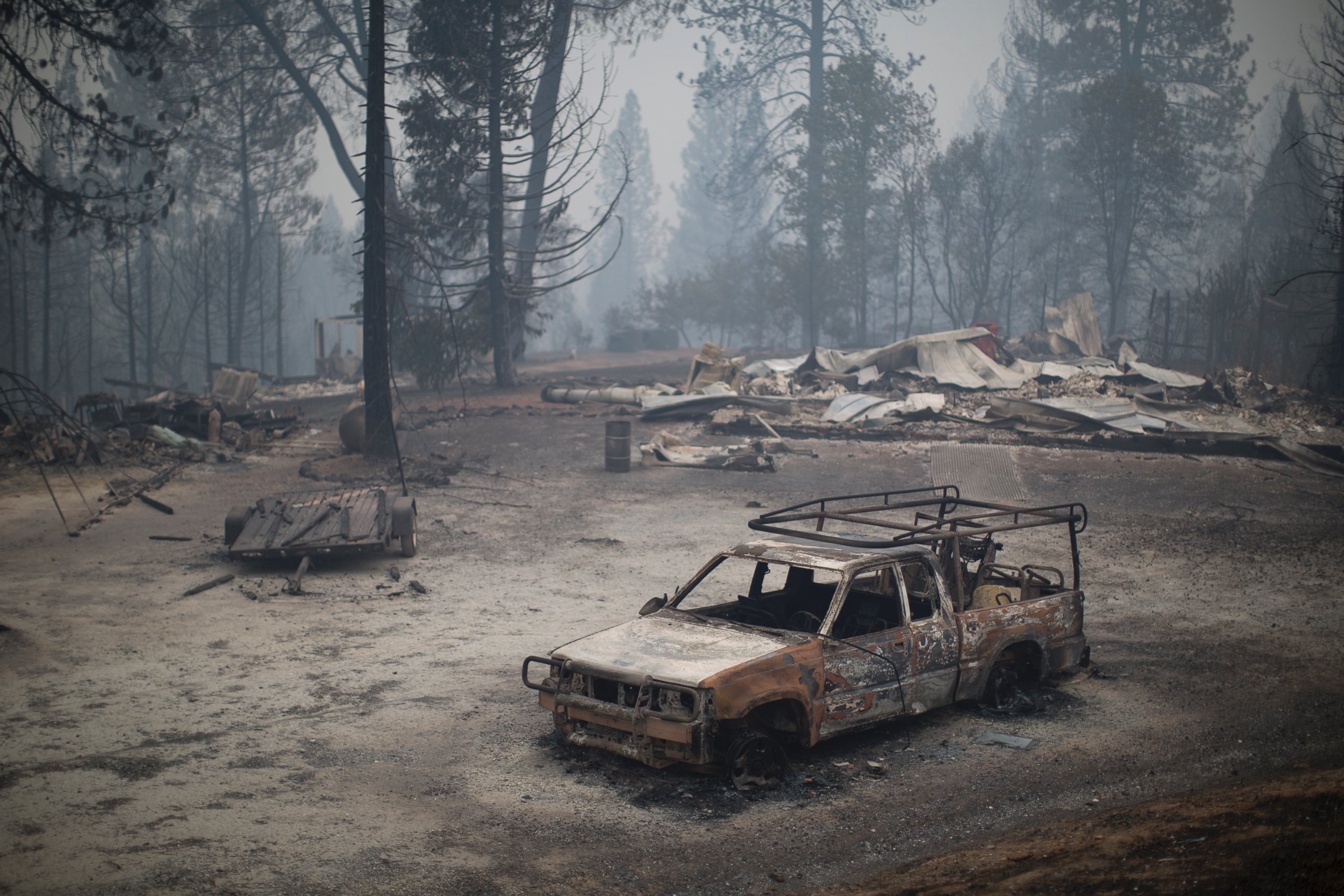 PHOTO: A burned truck and structures are seen at the Butte Fire, Sept. 13, 2015 near San Andreas, Calif.  
