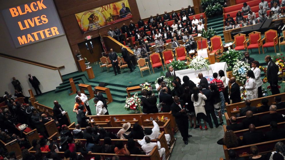 Freddie Gray's family pays its last respects while standing at his casket during his funeral at the New Shiloh Baptist Church during his funeral in Baltimore, April 27, 2015.