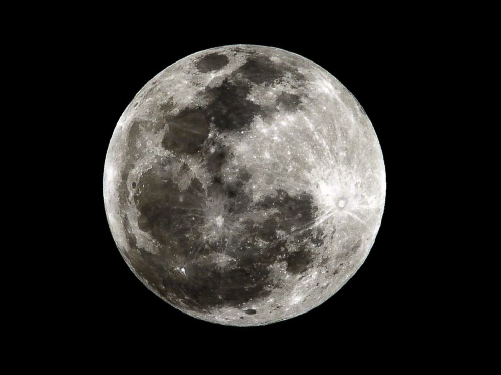 PHOTO: A full moon is seen before a total lunar eclipse in Bogota, Colombia, April 15, 2012.