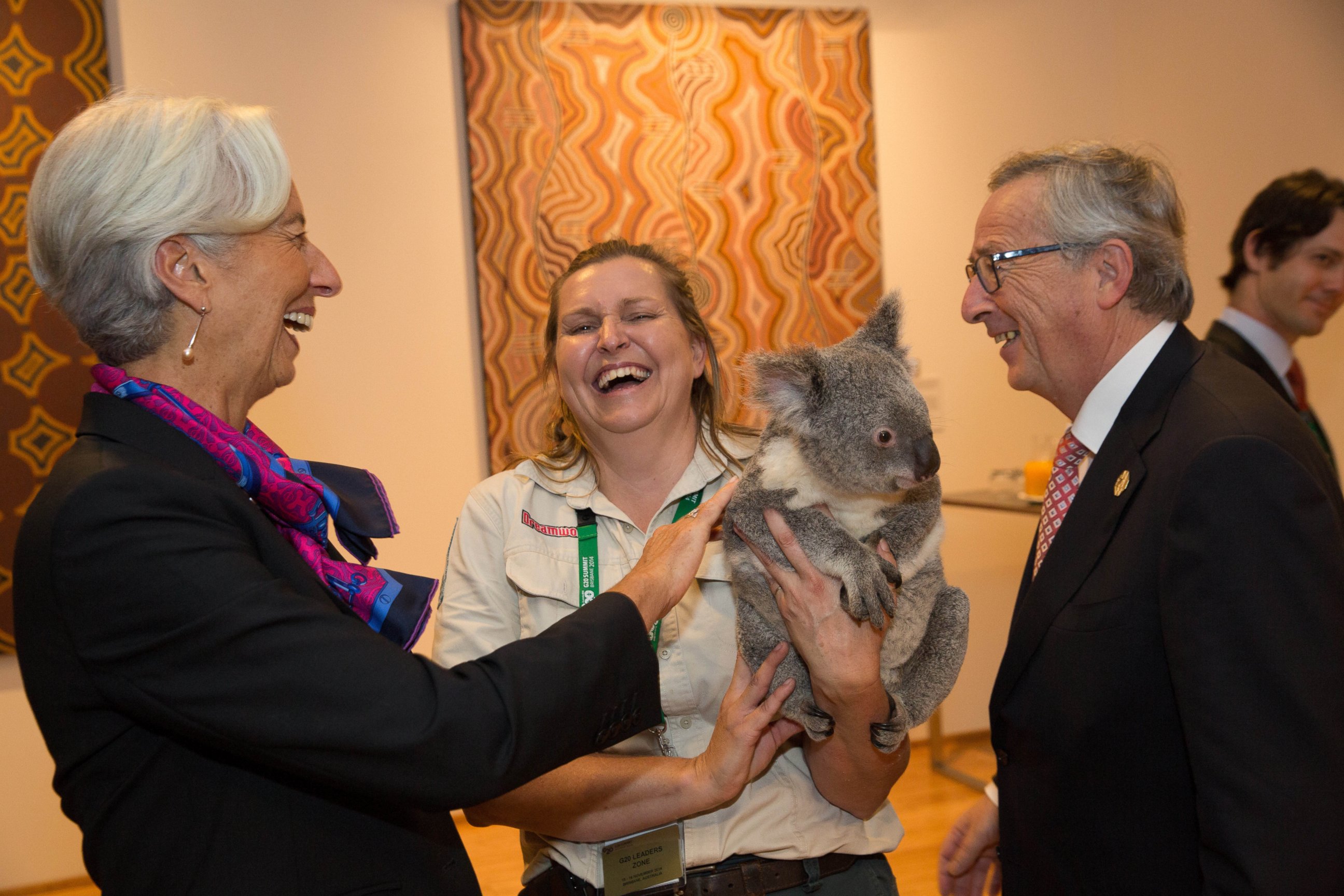 PHOTO: Christine Lagarde pats Jimbelung the koala, held by Michele Barneds, with Jean-Claude Juncker