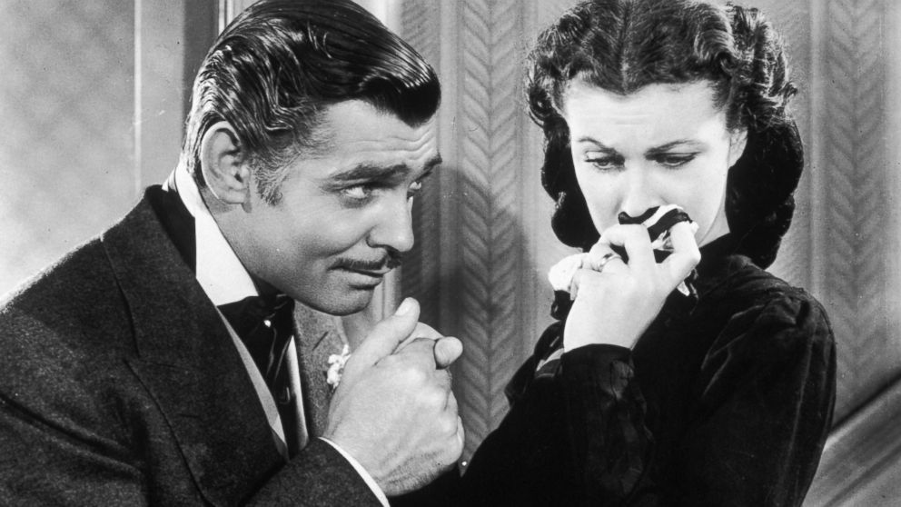 PHOTO: American actor Clark Gable in his role as Rhett Butler kissing the hand of a tearful Scarlett O'Hara, played by Vivien Leigh in 'Gone With the Wind.' 