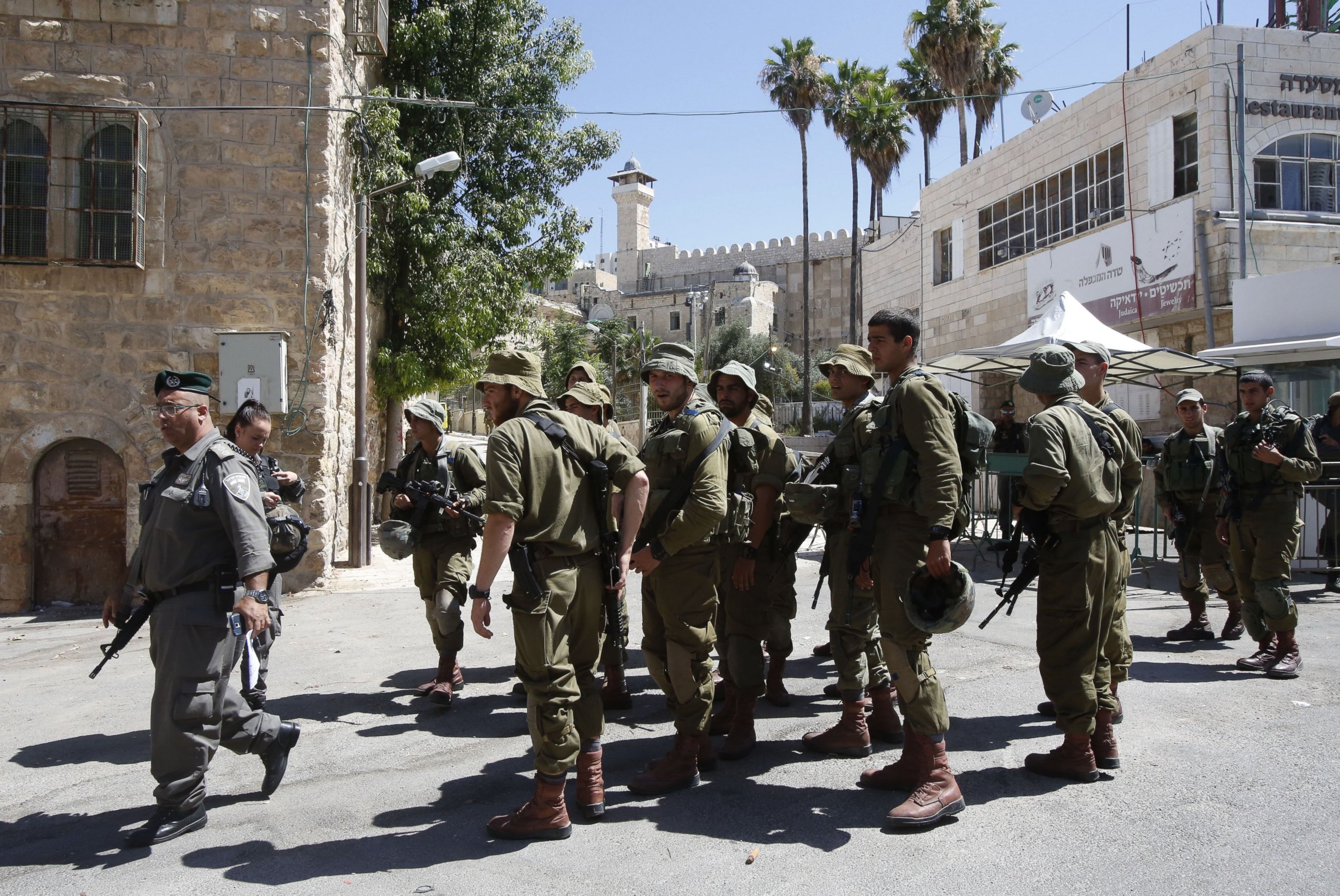 PHOTO: Israeli security forces gather near the entrance of a religious site known to Muslims as the Ibrahimi Mosque and to Jews as the Cave of the Patriarchs, July 1, 2016. 