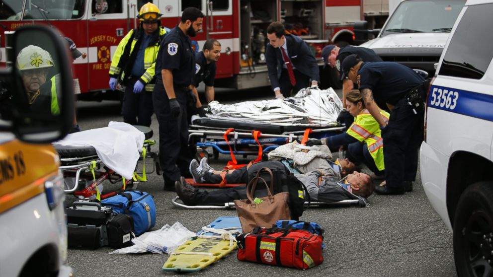 PHOTO: People are treated for their injuries outside after a NJ Transit train crashed in to the platform at Hoboken Terminal, Sept. 29, 2016, in Hoboken, New Jersey. 