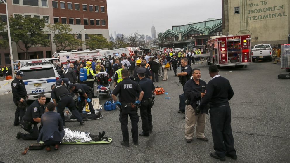PHOTO: First responders treat injured passengers after a New Jersey Transit train crashed into the platform at Hoboken Terminal during morning rush hour Sept. 29, 2016 in Hoboken, New Jersey.