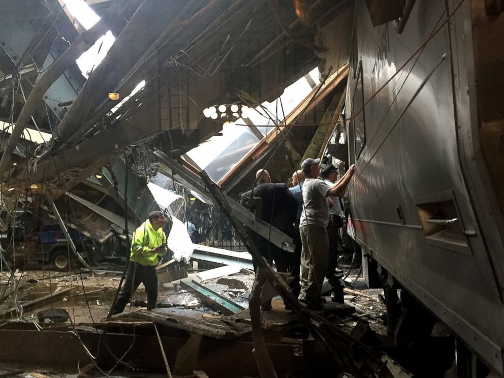 PHOTO: Train personnel survey the NJ Transit train that crashed in to the platform at the Hoboken Terminal Sept. 29, 2016 in Hoboken, New Jersey.