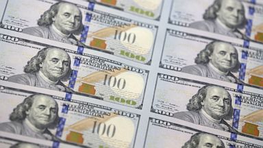 PHOTO: A sheet of uncut $100 bills.