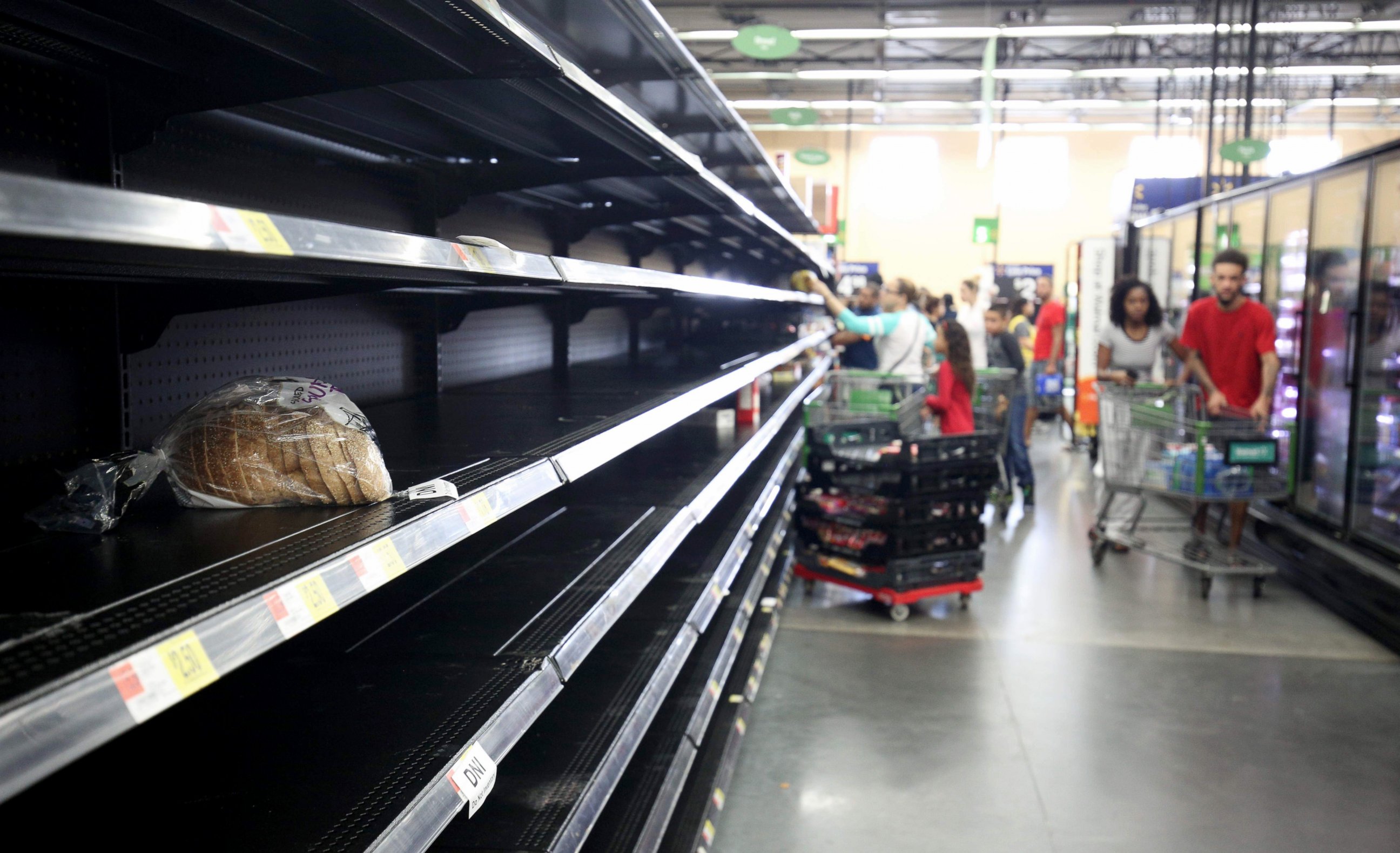 PHOTO: A loaf of bread is all that was left in the bread aisle of a Wal-Mart supermarket in Kissimmee, Florida as people buy supplies in preparation for the landfall of Hurricane Matthew, Oct. 6, 2016.