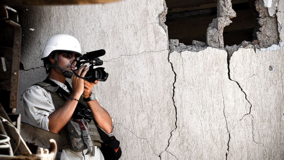 James Foley films Libyan NTC fighters attacking the west side of Colonel Gaddafi's home city of Sirte, Oct. 05, 2011, in Libya.