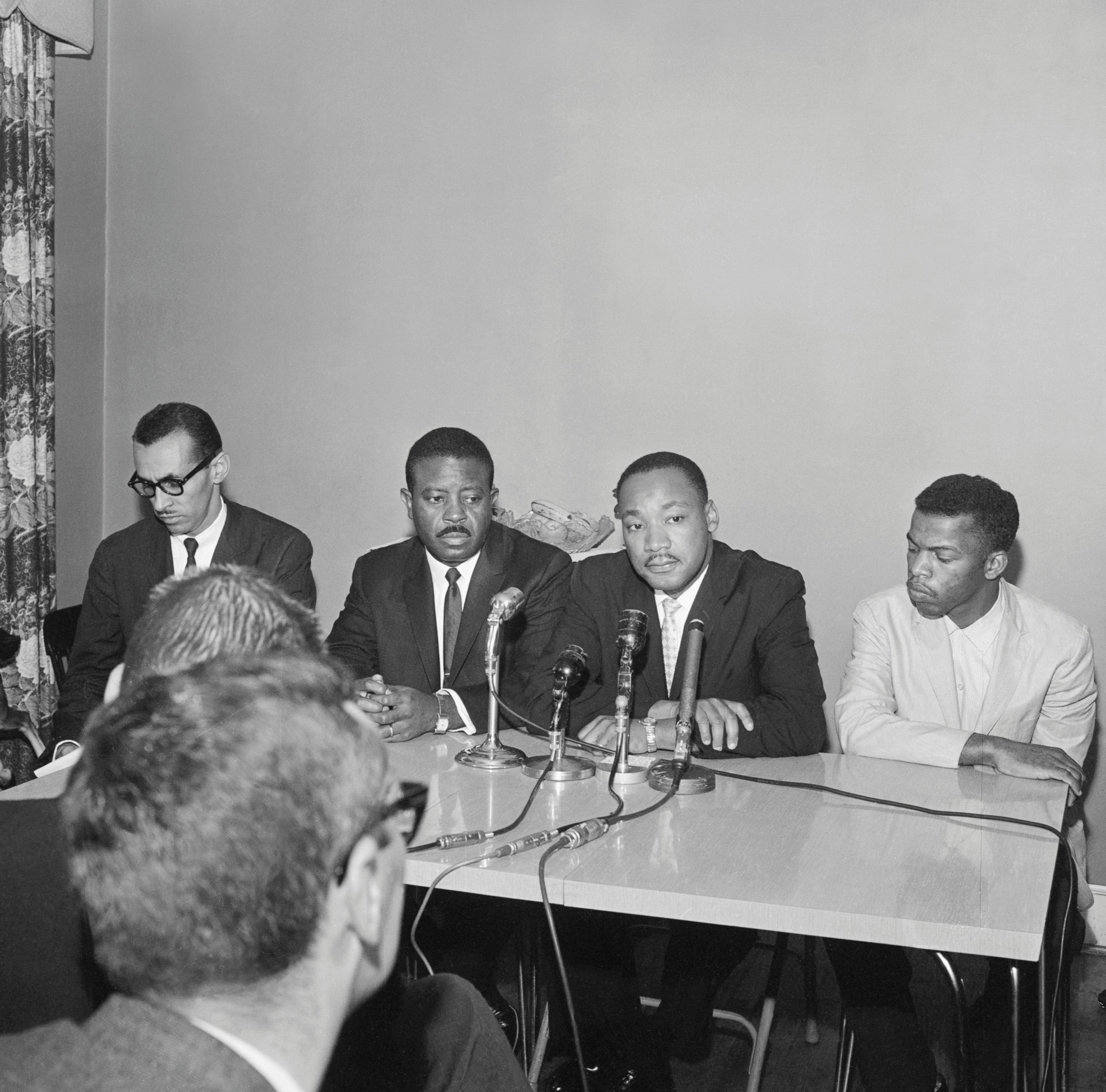 PHOTO: Leaders of the Freedom Riders, from left, Reverend Ralph Abernathy, Reverend Martin Luther King Jr., and John Lewis hold a press conference in Montgomery, Alabama. 