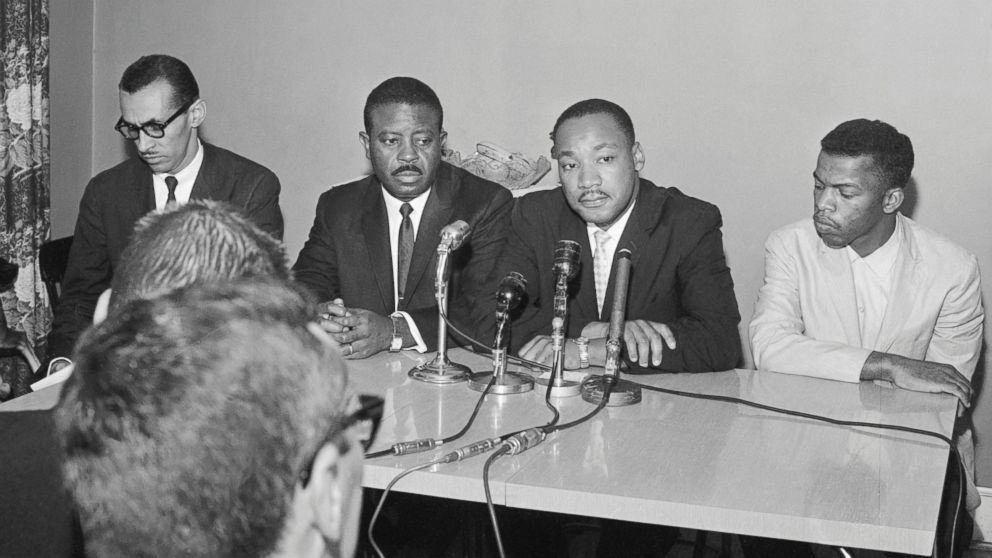 PHOTO: Leaders of the Freedom Riders, from left, Reverend Ralph Abernathy, Reverend Martin Luther King Jr., and John Lewis hold a press conference in Montgomery, Alabama. 