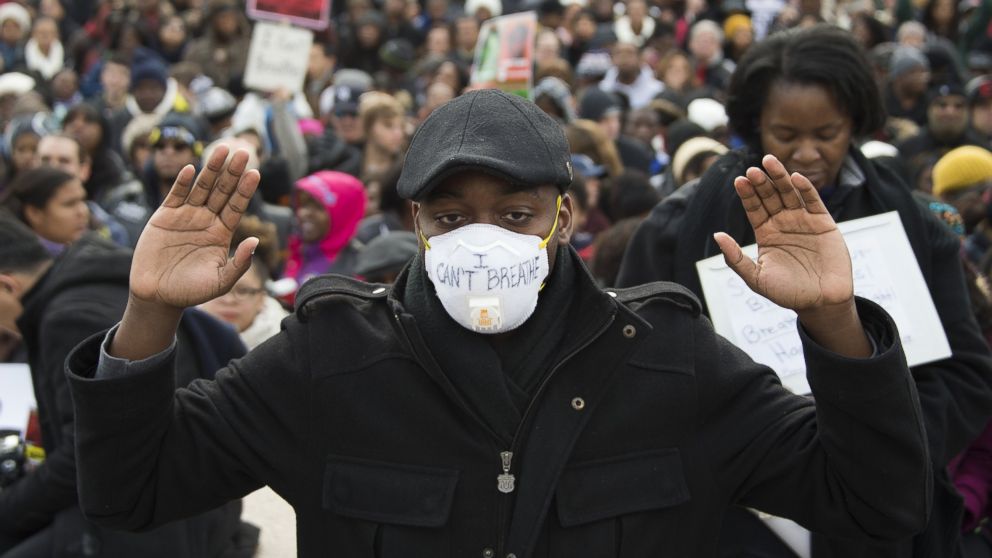 PHOTO: Preston Miller holds his hands up during the Justice For All march in Washington, Dec. 13, 2014. 