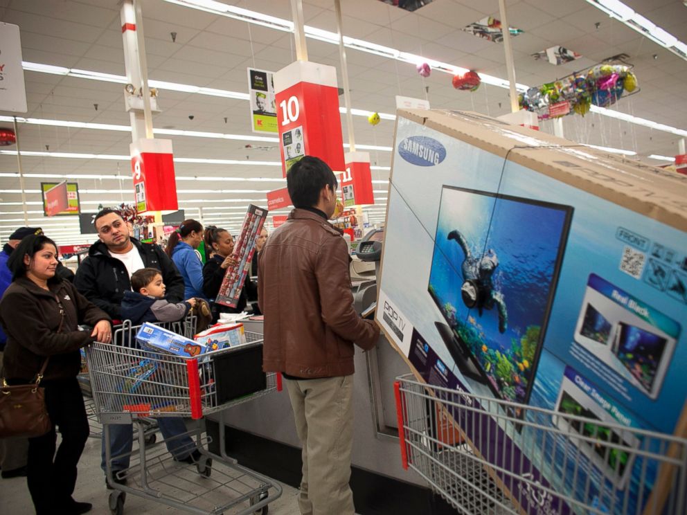 PHOTO: Shoppers wait in a check out line at a Kmart store during the Black Friday sales, Nov. 23, 2012, in Braintree, Mass.