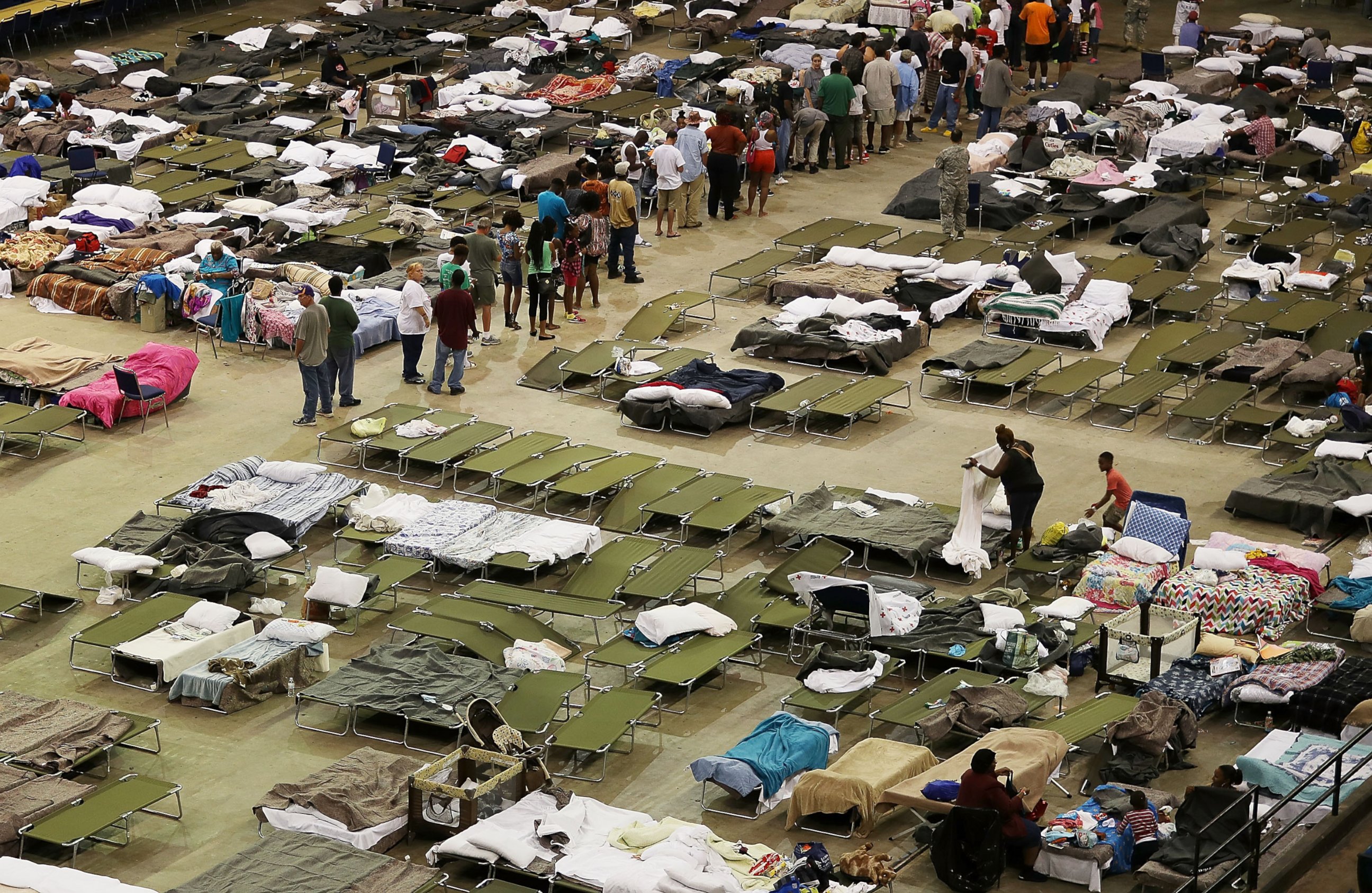 PHOTO: Evacuees stay at a shelter setup in the The Baton Rouge River Center arena while the area deals with the record flooding, Aug. 19, 2016, in Baton Rouge, Louisiana. 