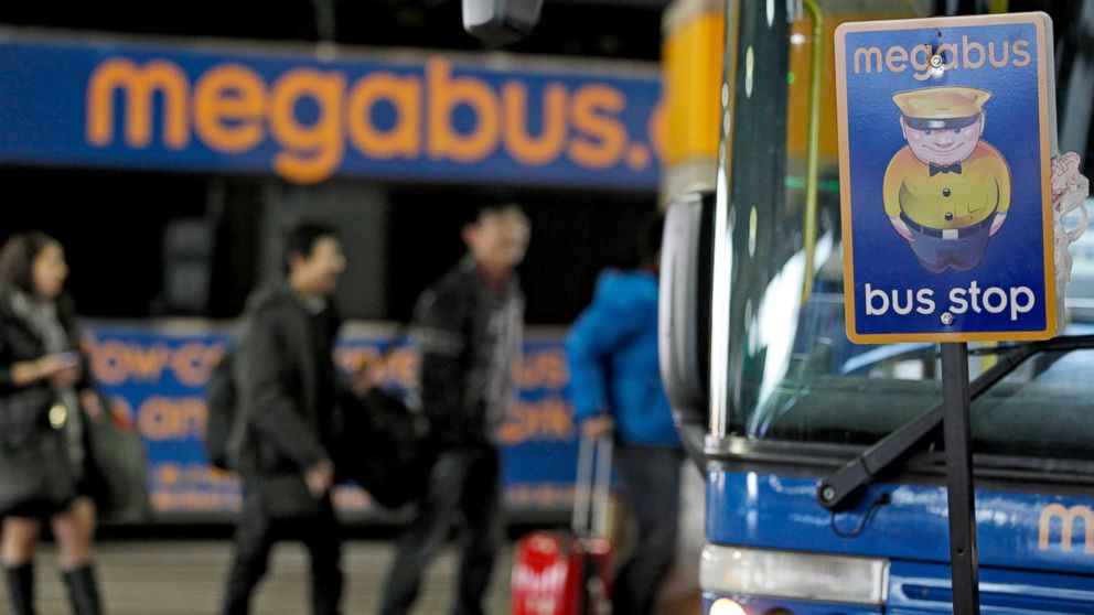 Passengers board a Megabus in Washington, Jan. 4, 2013. An 11-yr-old boy who went missing was found on a Megabus bound for Atlanta.
