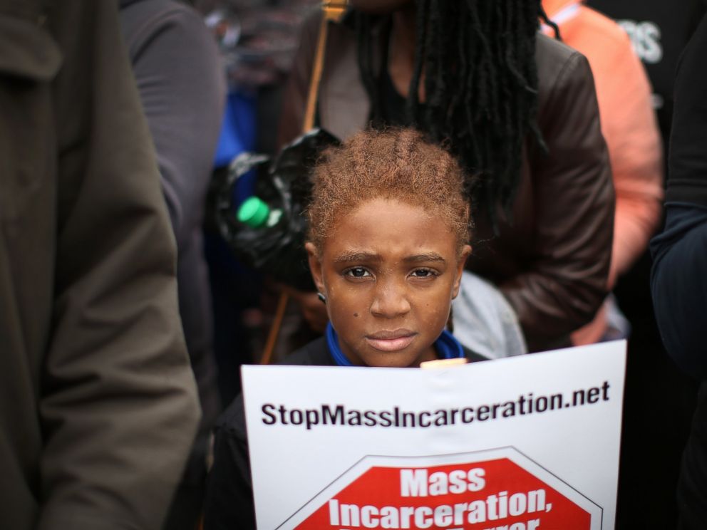 PHOTO: Nine-year-old Bill Jackson joins demonstrators, inspired by the August 9 death of Michael Brown in Ferguson, Mo., in a march through downtown to protest racial injustice, Oct. 11, 2014 in St. Louis.