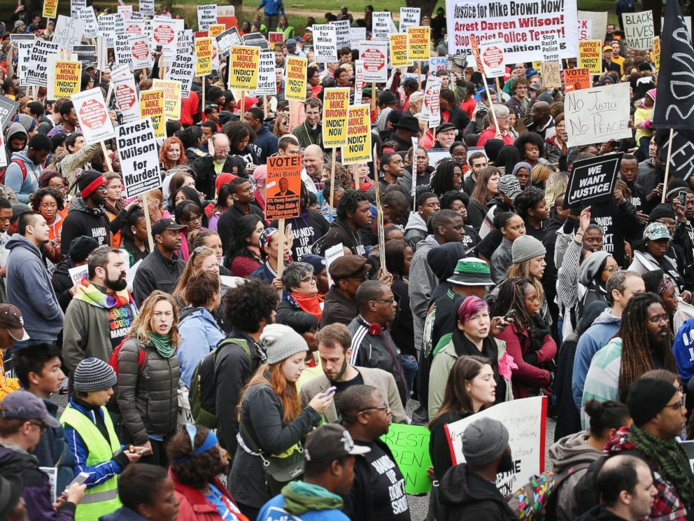 PHOTO: Inspired by the August 9 death of Michael Brown in Ferguson, Mo., demonstrators march through downtown to protest racial injustice, Oct. 11, 2014 in St. Louis.