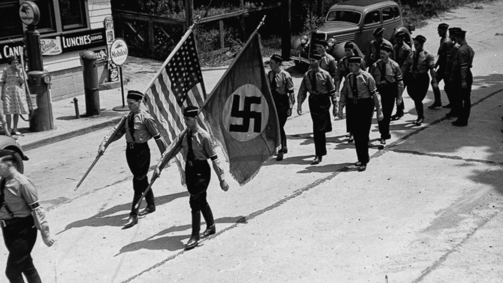 PHOTO:American Nazi party members march while carrying Nazi and American flags during a Bund outing from nearby Camp Sigfried, Jan. 01, 1937. 