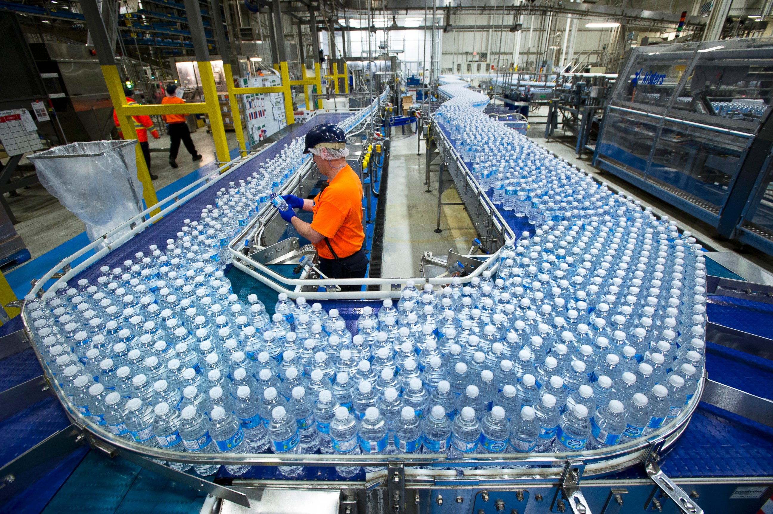 PHOTO: A worker inspects bottles of water at the Nestle Waters Canada plant near Guelph, Ontario, Canada on Jan. 16, 2015. 