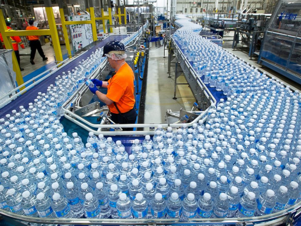 PHOTO: A worker inspects bottles of water at the Nestle Waters Canada plant near Guelph, Ontario, Canada on Jan. 16, 2015.