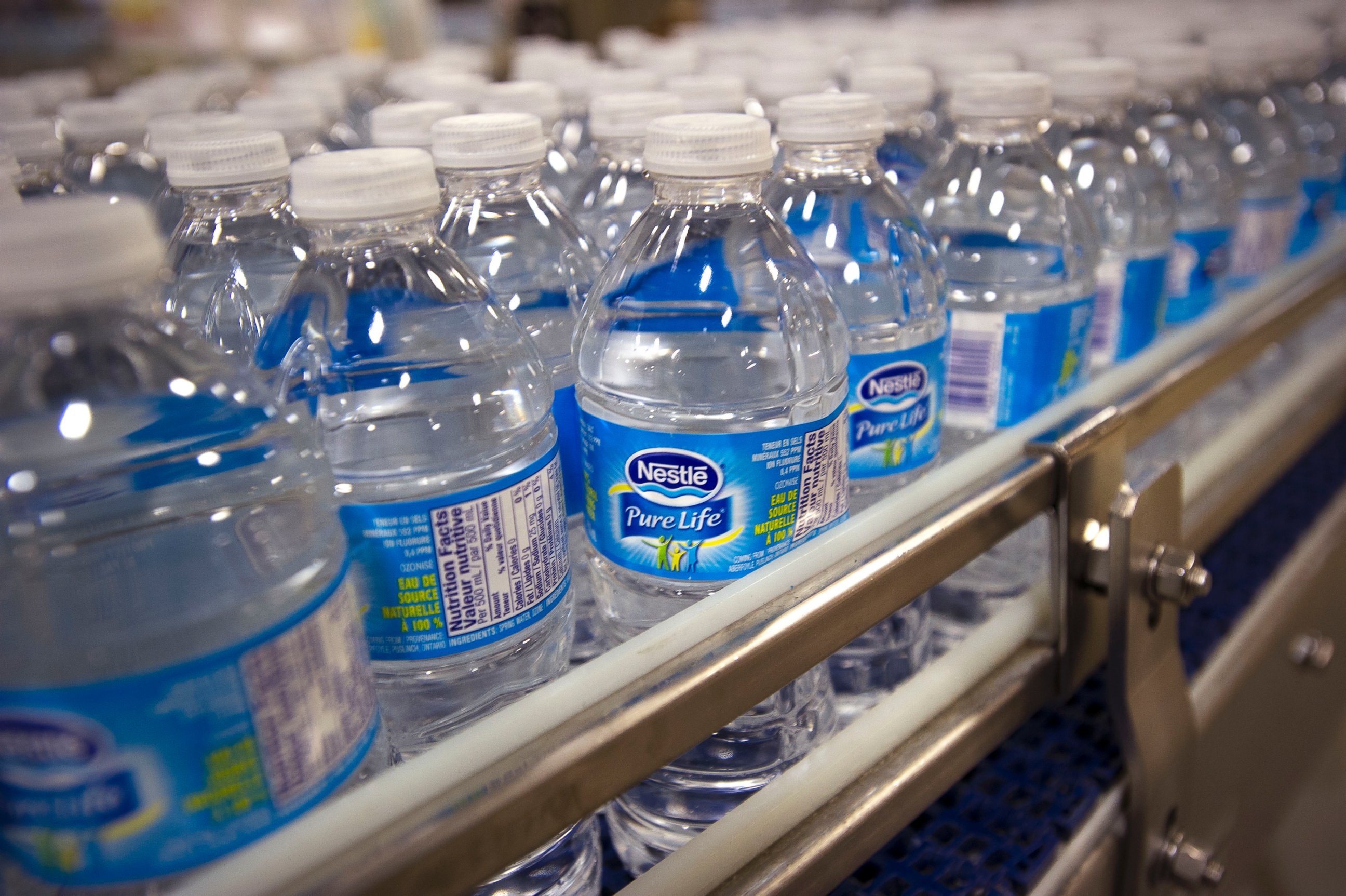 PHOTO: Bottles of Pure Life brand water are pictured on the production line at the Nestle Waters Canada plant near Guelph, Ontario, Canada on Jan. 16, 2015.