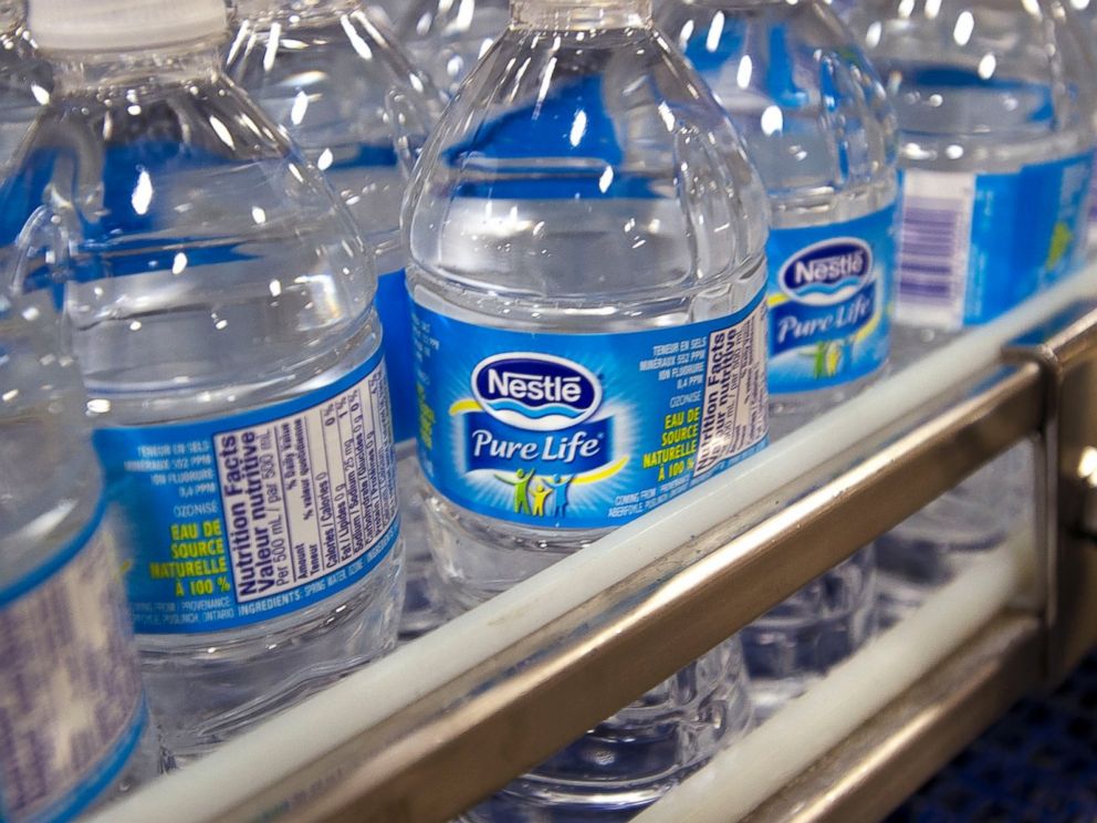 PHOTO: Bottles of Pure Life brand water are pictured on the production line at the Nestle Waters Canada plant near Guelph, Ontario, Canada on Jan. 16, 2015.